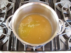 Boiling stock in a stockpot.