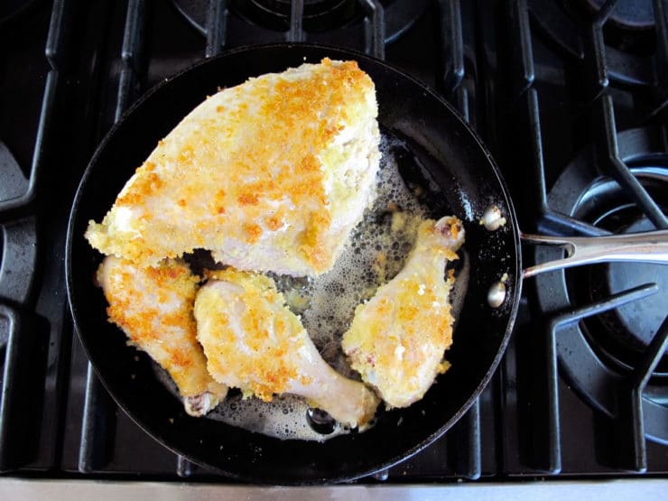Browning chicken in a skillet.