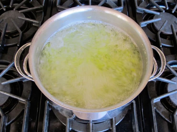 Sliced leeks boiling in water.