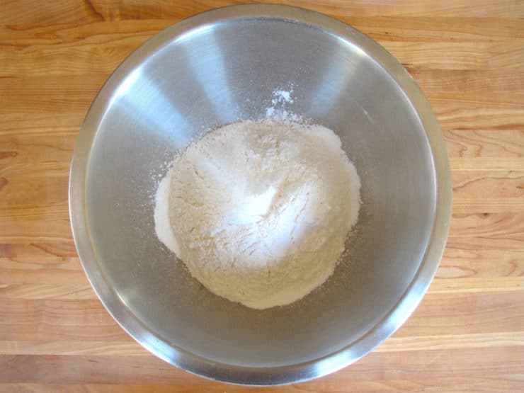 Sifted flour in a mixing bowl.