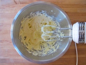 Beating butter into sugar for icing.