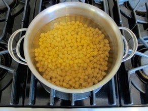 Quick soaking chickpeas in large pot on stovetop.