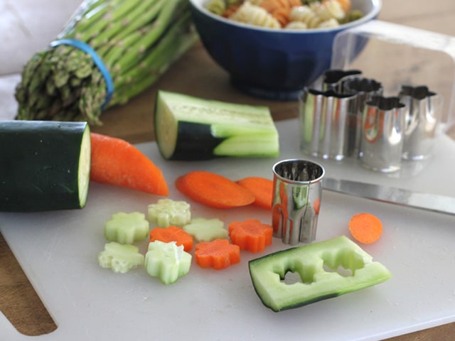 Cutting vegetables into fun shapes.