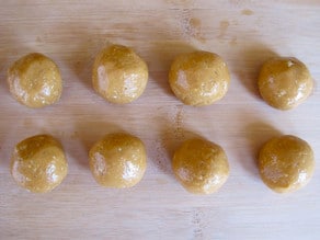 Peanut butter honey truffle balls on wax paper.
