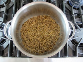 Cooking lentils in a stockpot.