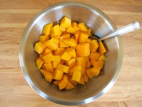 Butternut squash cubes in a mixing bowl.