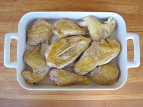 Browned chicken in a baking dish.
