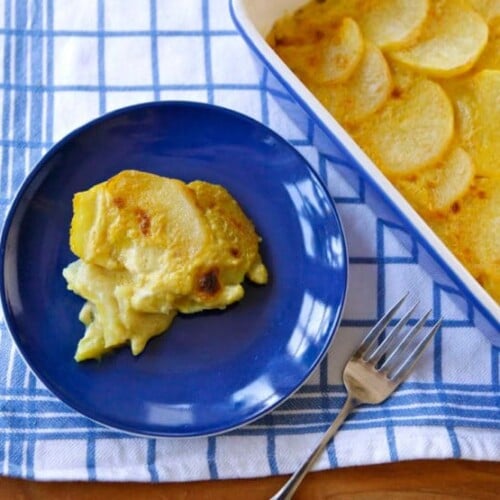 Dairy Free Saffron Scalloped Potatoes served on a blue plate