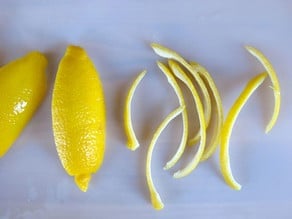 Lemon peel sliced into thin strips.
