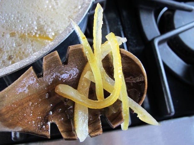 Checking lemon peels for doneness.