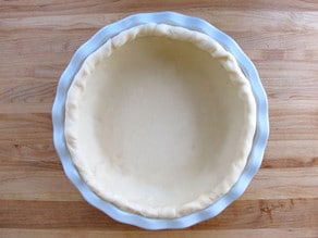 Pie dish lined with crust dough.