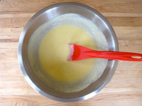 Stirring yogurt into cake batter.