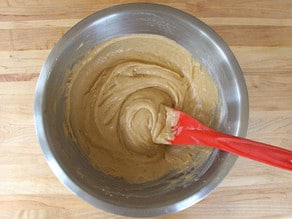 Wet and dry cake ingredients mixed in a bowl.