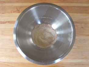 Dry ingredients sifted into a mixing bowl.