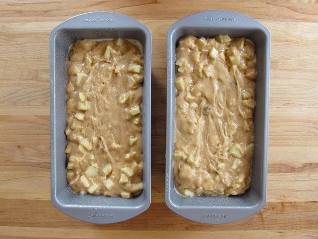 Apple cake batter in two loaf pans.