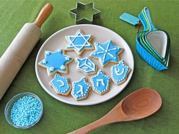 Holiday sugar cookies with blue icing and festive designs