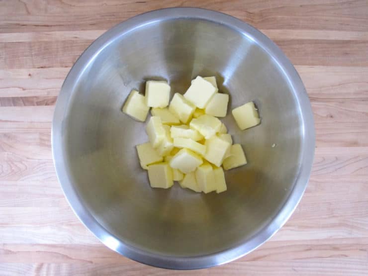 Cubed butter in a mixing bowl.