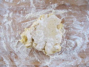 Cookie dough on a floured surface.