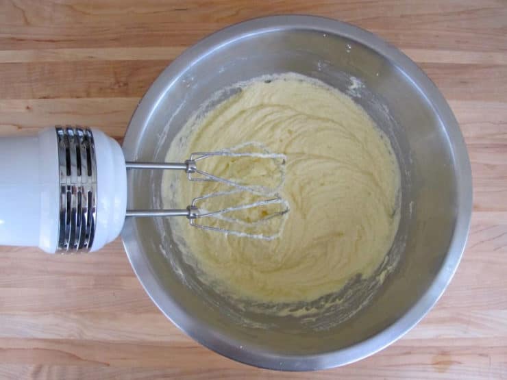 Eggs added to batter in a bowl.