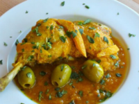 A flavorful dish featuring tender chicken, tangy lemon, and savory olives