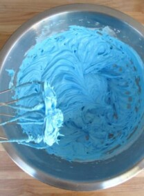 Adding dye to icing.
