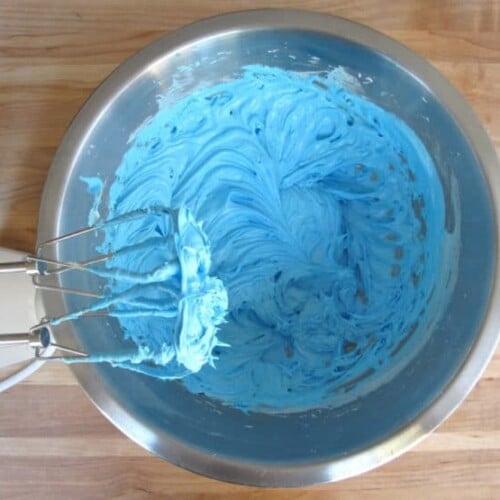 Adding dye to icing.