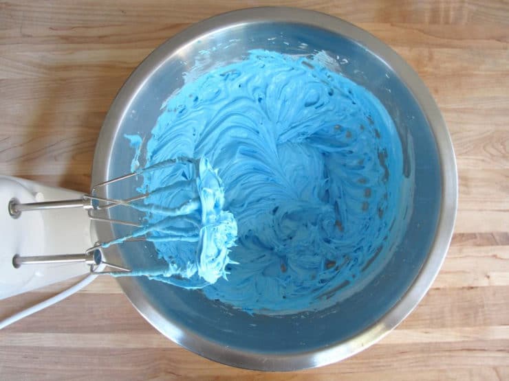 Adding dye to icing.