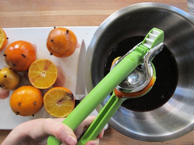 Juicing oranges into wine.