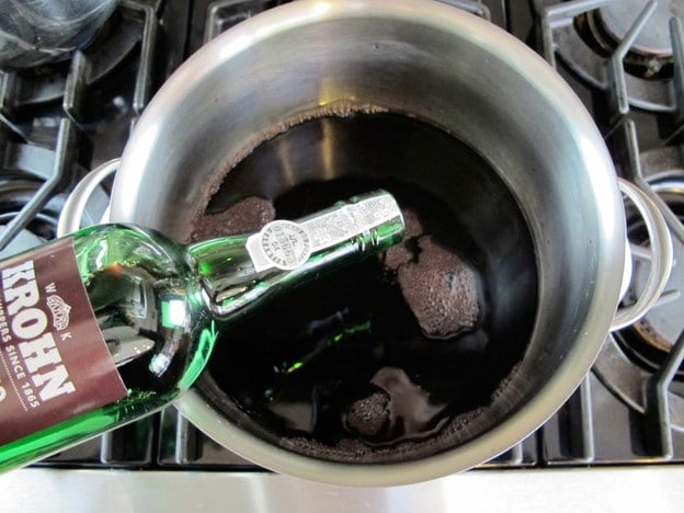 Adding port into red wine.