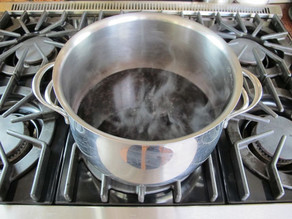 Heating wine in a stockpot.