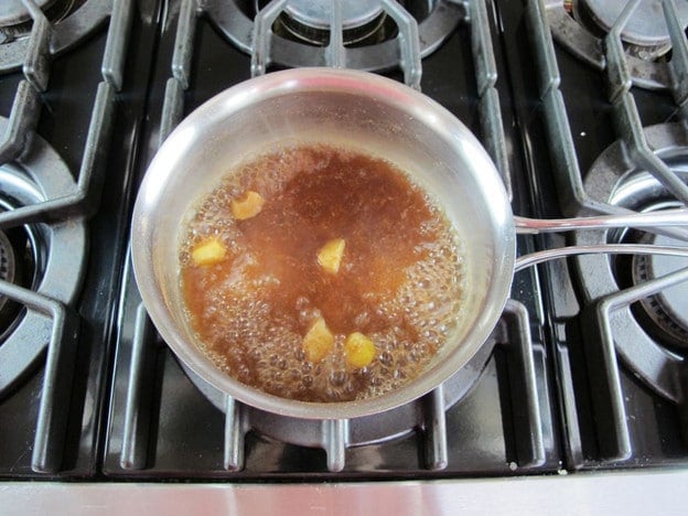 Simmering spices in a saucepan.