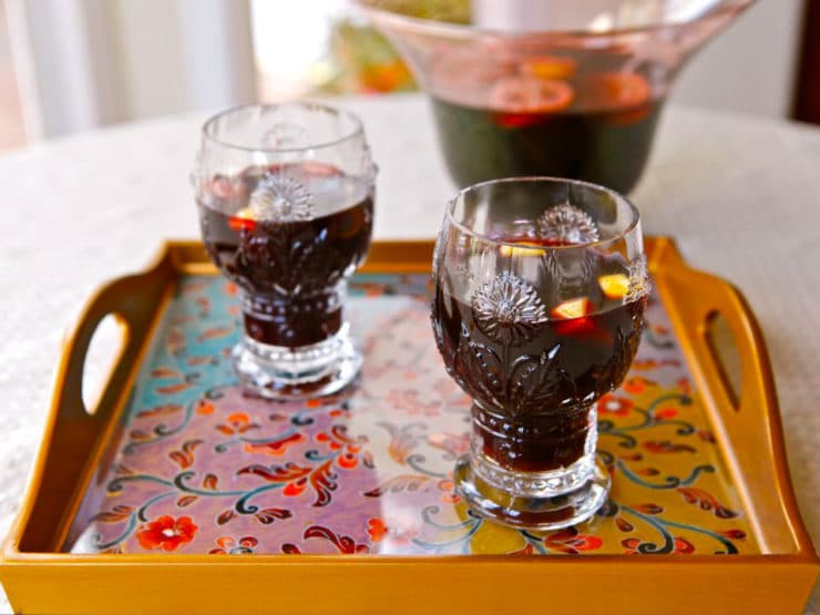 Close-up of smoking bishop drink served in a two fancy glasses on top of a nice looking tray