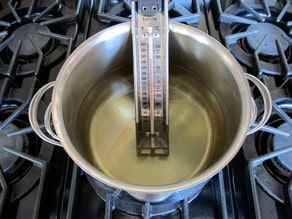 Measuring oil temperature for frying.