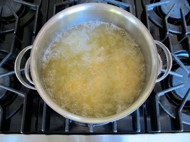 Chicken parts deep frying.