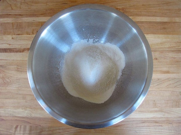 Dry ingredients for waffles in a mixing bowl.