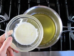 Skimming foam from melting butter.