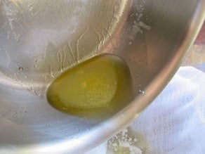 Remaining butterfat in a saucepan.