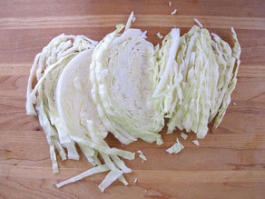 Freshly chopped cabbage on a cutting board