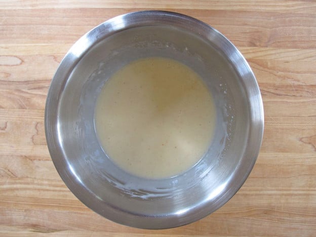 Slaw dressing in a mixing bowl.