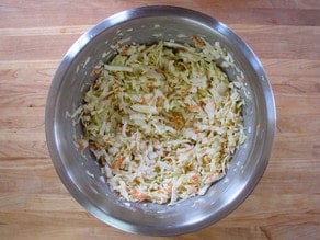 Slaw mixed up in a bowl.