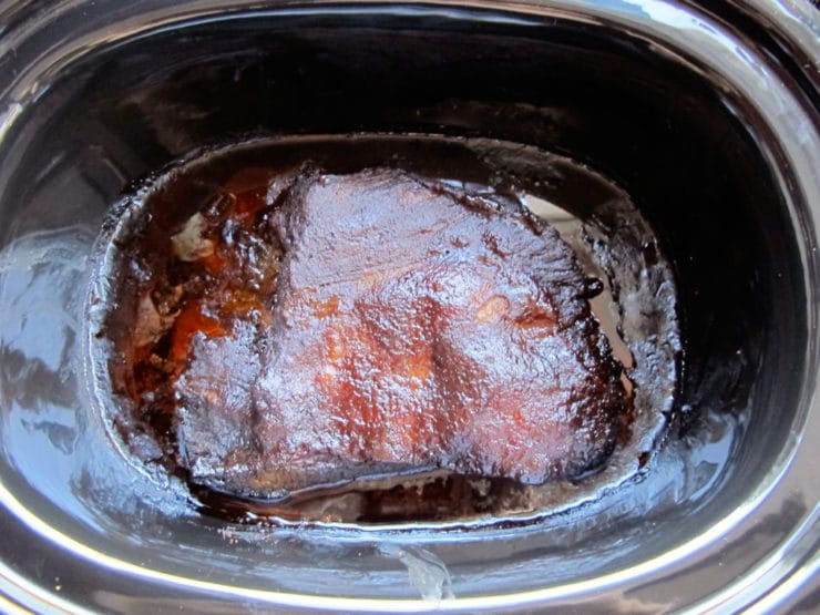Cooked brisket in the slow cooker.