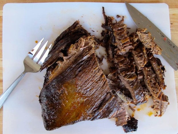 Slicing brisket against the grain.