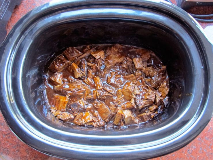 Shredded beef in the slow cooker.