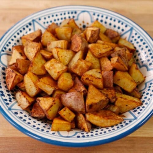 Smoked Paprika Roasted Potatoes served on a blue plate