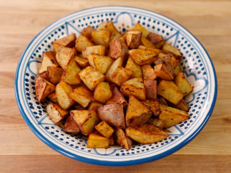 Smoked Paprika Roasted Potatoes served on a blue plate