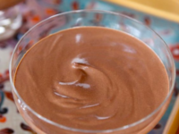 A vibrant tray displays three Greek Yogurt Chocolate Mousse, delectable chocolate desserts