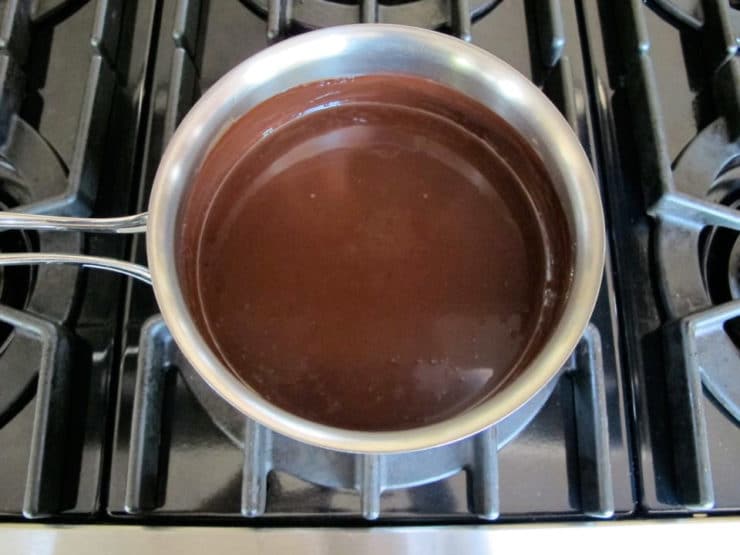 Melting chocolate into warm milk.