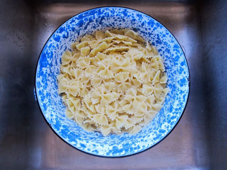 Cooked pasta in a colander.