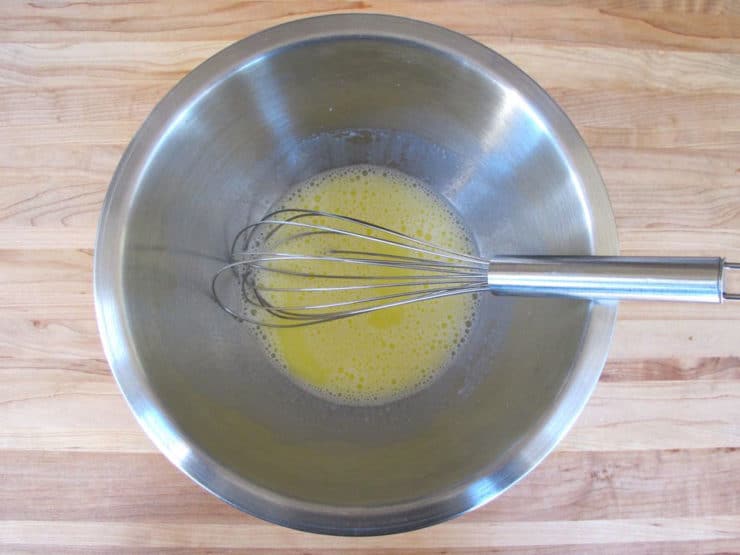 Milk and butter whisked together in a small bowl.