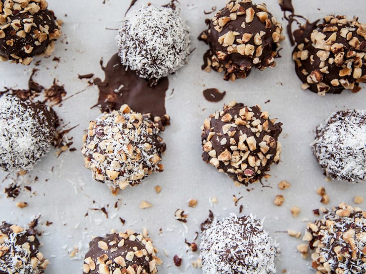 Kosher for Passover Chocolate Covered Marble Cake Bites - Kosher for Passover cake bites covered in dark chocolate and dipped in chopped nuts, sweetened coconut or any topping you'd like! From Heidi Larsen of FoodieCrush.